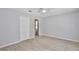 This bedroom includes en-suite bathroom and wood-look floors at 2742 Woodruff Dr, Orlando, FL 32837