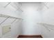 Spacious walk-in closet with wood floors and multiple levels of wire shelving for organized storage at 300 E South St # 6016, Orlando, FL 32801