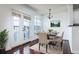 Dining area with hardwood floors, chandelier and balcony access at 300 E South St # 6016, Orlando, FL 32801