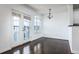 Hardwood floors and natural light illuminate the dining room, which includes balcony access at 300 E South St # 6016, Orlando, FL 32801