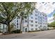 Exterior view of building with multiple windows and palm trees surrounding at 300 E South St # 6016, Orlando, FL 32801