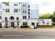 Beautiful exterior of The Grande, featuring manicured landscaping and covered entry at 300 E South St # 6016, Orlando, FL 32801