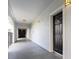 Hallway leading to unit with neutral paint and recessed lighting at 300 E South St # 6016, Orlando, FL 32801