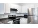 Kitchen features stainless steel appliances and stone countertops at 300 E South St # 6016, Orlando, FL 32801