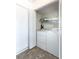 Convenient laundry area equipped with a full-size washer and dryer and extra storage shelf at 300 E South St # 6016, Orlando, FL 32801