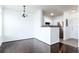 Living space that flows into the kitchen area with stainless steel appliances and a breakfast bar at 300 E South St # 6016, Orlando, FL 32801