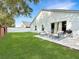 Backyard with a well-manicured lawn and patio area at 3101 Linton Rd, Kissimmee, FL 34758
