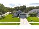 Inviting single-story home boasts a neatly kept lawn, a two-car garage, and lovely curb appeal at 3101 Linton Rd, Kissimmee, FL 34758