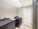 Modern laundry room with new machines, neutral paint, and tile floor at 3101 Linton Rd, Kissimmee, FL 34758