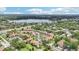 Community aerial emphasizing roadways, lush trees and landscaping, and proximity to a lake at 3118 S Semoran Blvd # 2, Orlando, FL 32822