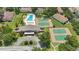 Aerial view of a community showcasing a refreshing pool and tennis courts, surrounded by beautifully landscaped grounds at 3118 S Semoran Blvd # 2, Orlando, FL 32822