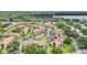Community aerial showcasing meticulous landscaping, a nearby roadway, and multiple condominium buildings at 3118 S Semoran Blvd # 2, Orlando, FL 32822
