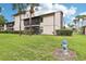 Backyard with manicured lawn featuring mature trees and a fire hydrant at 3118 S Semoran Blvd # 2, Orlando, FL 32822