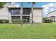 A well-manicured lawn and patio offer a serene backyard setting for relaxation and outdoor enjoyment at 3118 S Semoran Blvd # 2, Orlando, FL 32822