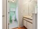 Well-maintained bathroom with neutral tones features a vanity with storage and toilet at 3118 S Semoran Blvd # 2, Orlando, FL 32822