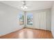 This bedroom is brightly lit with a ceiling fan and a double closet at 3118 S Semoran Blvd # 2, Orlando, FL 32822