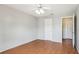 Bright bedroom with hardwood floors, ceiling fan, and closet offers a comfortable living space at 3118 S Semoran Blvd # 2, Orlando, FL 32822
