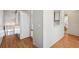 Entryway featuring laminate flooring, coat closet, and stairway to the left at 3118 S Semoran Blvd # 2, Orlando, FL 32822