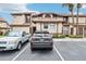 Exterior of two story condo with visible reserved parking spaces in front at 3118 S Semoran Blvd # 2, Orlando, FL 32822