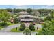 Exterior shot of community center with well-maintained landscaping and circular driveway at 3118 S Semoran Blvd # 2, Orlando, FL 32822