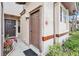 Inviting front door is accented by vibrant landscaping and a charming exterior at 3118 S Semoran Blvd # 2, Orlando, FL 32822