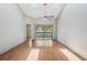 Living room featuring vaulted ceilings, fan, skylights, and slider to porch at 3118 S Semoran Blvd # 2, Orlando, FL 32822
