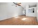 A spacious living room offers abundant natural light and a stylish ceiling fan for comfort at 3118 S Semoran Blvd # 2, Orlando, FL 32822