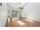 The bright living room features a sliding glass door and a ceiling fan at 3118 S Semoran Blvd # 2, Orlando, FL 32822