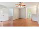 Spacious living room with hardwood floors, ceiling fan, and easy access to other rooms at 3118 S Semoran Blvd # 2, Orlando, FL 32822