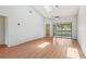 The sunlit living room has a ceiling fan, skylights, and access to the porch at 3118 S Semoran Blvd # 2, Orlando, FL 32822