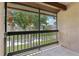 Screened porch with a view of the beautiful trees and manicured lawn at 3118 S Semoran Blvd # 2, Orlando, FL 32822