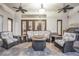 Back patio with ceiling fans has lots of furniture and a grill at 3316 Regal Crest Dr, Longwood, FL 32779