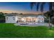 An inviting backyard with a private pool and a covered patio, perfect for outdoor entertaining at 3316 Regal Crest Dr, Longwood, FL 32779