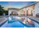 Relax poolside under the covered patio, complete with fan and outdoor seating at 3316 Regal Crest Dr, Longwood, FL 32779