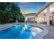 The backyard pool area features a covered patio, perfect for outdoor dining at 3316 Regal Crest Dr, Longwood, FL 32779