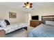 Cozy bedroom with two beds, a ceiling fan, and neutral decor, perfect for relaxation at 3316 Regal Crest Dr, Longwood, FL 32779