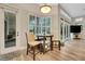 Breakfast nook area with natural light beaming through the windows and views of the backyard at 3316 Regal Crest Dr, Longwood, FL 32779