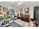 Exercise room featuring equipment, fan, and Simpsons decor at 3316 Regal Crest Dr, Longwood, FL 32779