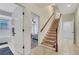 Inviting hallway with stairway, tile floors and open doorway to bathroom and bedroom, providing easy access to all areas of the home at 3316 Regal Crest Dr, Longwood, FL 32779