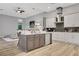 Open concept kitchen with island, stainless steel appliances, and adjacent living area at 3316 Regal Crest Dr, Longwood, FL 32779