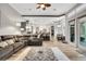 Spacious living room showcasing an open layout, bar seating, and views of the pool at 3316 Regal Crest Dr, Longwood, FL 32779