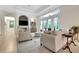 Open-concept living room with fireplace, built-in bar and patio access for seamless indoor-outdoor living at 3316 Regal Crest Dr, Longwood, FL 32779
