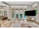 Bright living room with backyard pool view from expansive windows and sliding glass doors at 3316 Regal Crest Dr, Longwood, FL 32779