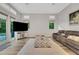 Bright living room with media center, modern furniture, and plantation shutters at 3316 Regal Crest Dr, Longwood, FL 32779