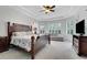 The main bedroom features a tray ceiling, carpeted floors and an abundance of natural light at 3316 Regal Crest Dr, Longwood, FL 32779