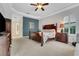 A beautifully decorated main bedroom features a tray ceiling and lovely furniture at 3316 Regal Crest Dr, Longwood, FL 32779