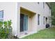 Rear patio offers outdoor relaxation space, with sliding door access and well-maintained landscaping at 3569 Seneca Club Loop # 13, Orlando, FL 32808