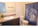 Full bathroom with toilet, vanity, shower and decorated with moon themed shower curtain at 3569 Seneca Club Loop # 13, Orlando, FL 32808