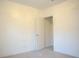 Bright bedroom with large closet, neutral carpet, and white walls at 3569 Seneca Club Loop # 13, Orlando, FL 32808