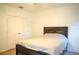 Well-lit bedroom featuring a comfortable bed, ceiling fan, and large closet at 3569 Seneca Club Loop # 13, Orlando, FL 32808
